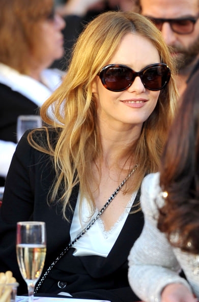 Vanessa Paradis smiles in her oversized sunglasses.